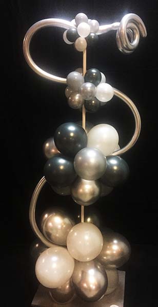 This 7 foot tall paranormal design decor column is created from black, white and silver balloons.