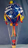 Our classic 30 inch diameter hot-air theme balloon bouquet comes in the color of your choice with a bottle of Martinelli's Gold-Medal™ sparkling cider in its passenger basket.