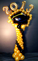 Balloon column topped by a graduation mortar board Mylar® balloon