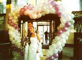 Seven foot tall walk-through Heart balloon sculpture entrance decoration for a wedding receptionr