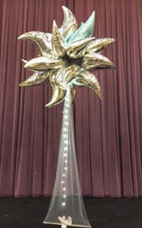 This 8 foot tall column decoration is created from silver mylar balloons and white tulle.