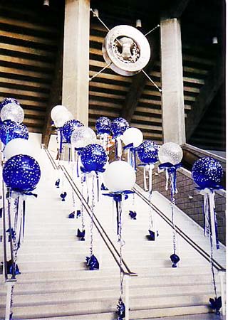 30 inch floating bubble balloons flanking entry stairs