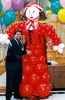 Red Riding Hood balloon sculpture for a nursery rhyme theme event