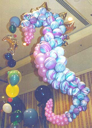 A 6 foot tall ballon suspended seahorse sculpture appears to swim for this underwater theme party