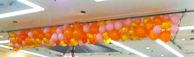 Net Style Drop of Orange and Gold Balloons