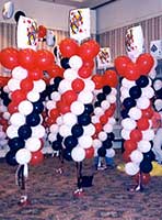 A red and black balloon column serves as an area decoration for casino theme events