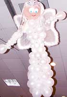 This pearl white balloon good fairy floats from a venue ceiling providing a decor that encompasses party goers from above