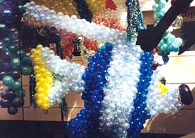 A giant suspended ballon sculpture of a blue tropical fish creates an underwater atmosphere