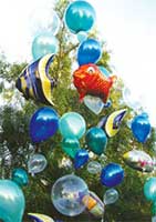 A giant suspended ballon sculpture of a blue tropical fish creates an underwater atmosphere