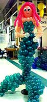 A 6 foot tall ballon mermaid sculpture adds a mystical look to this underwater theme party