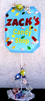Foamcore greeting sign for a candy theme mitzvah adorned with balloon candies
