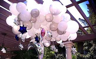 Giant cloud ceiling decoration with white, clear and silver balloons