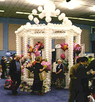 Twelve foot tall gazebo constructed of white balloons to serve as a trade show booth
