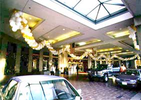 Garlands of gold, silver, white and clear balloons decorating the main entrance to the San Jose Fairmont Hotel for New Year's eve.