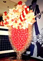 Balloon sculpture of a giant cherry soda in a crystal balloon glass brings back 50's memories